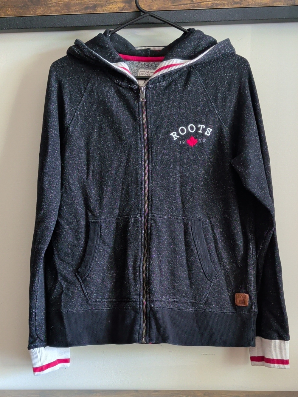 Roots Black Zip-Up Hoodie with Red Maple Accent